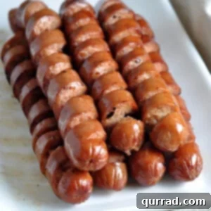 stack of spiral grilled hot dogs on serving platter