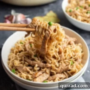 Garlic Ginger Pork Ramen Toss 6 Pork and ramen noodles on chopsticks over bowl