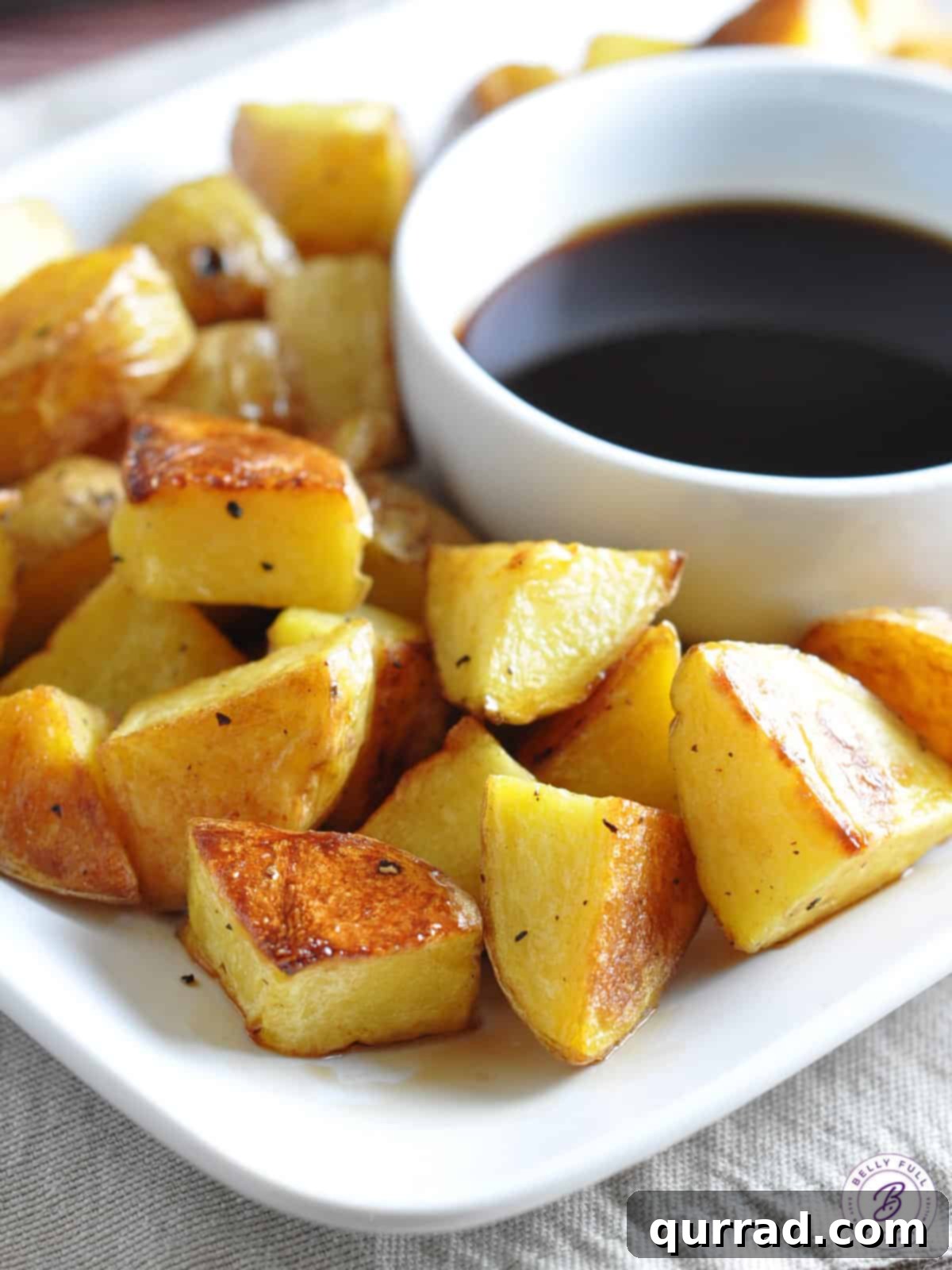 Crispy Malt Vinegar Roast Potatoes 2 plate of oven roasted potatoes with malt vinegar