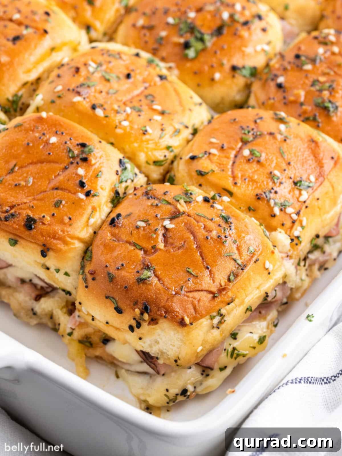 ham and cheese sliders in white baking dish
