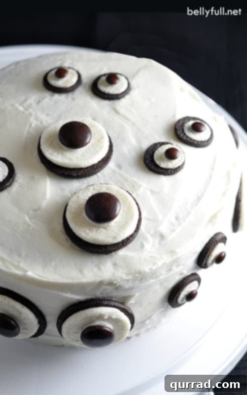 Spooky & Sweet: The Ultimate Easy Ghost Cake for Halloween Parties Delicious chocolate Ghost Cake decorated with Oreo eyes, perfect for Halloween celebrations