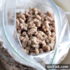 seasoned cooked ground meat crumbles in plastic bag