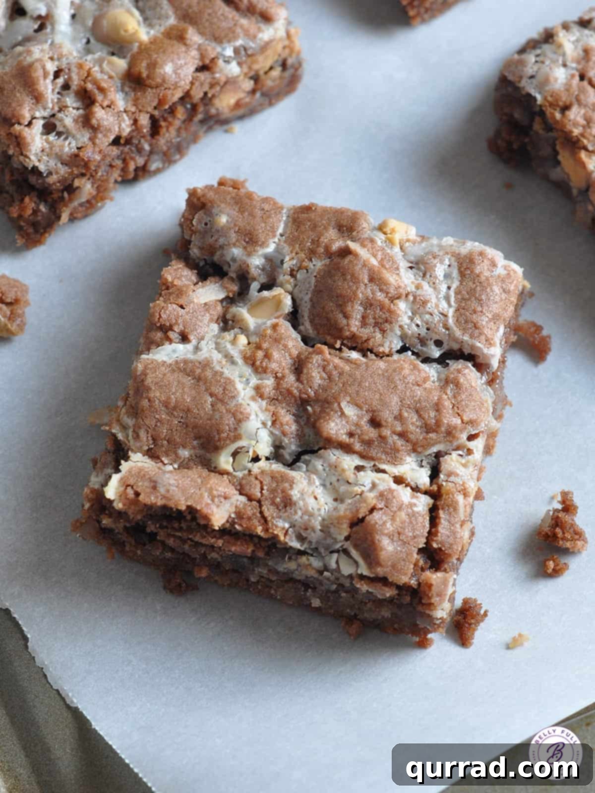 An overhead shot of German Chocolate Gooey Bars in a baking pan, ready to be cut and served.
