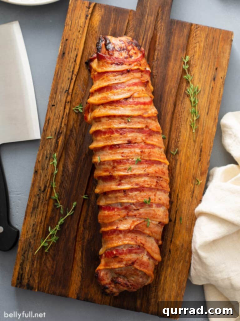 Crispy Bacon-Wrapped Pork Tenderloin 3 overhead whole roasted pork tenderloin wrapped in bacon