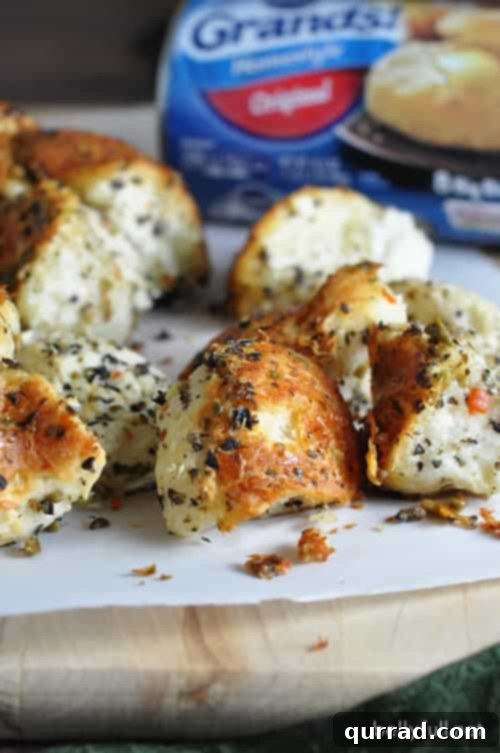 Easy Olive Pull-Apart Bread - super easy pull apart bread with butter, garlic, Parmesan, Italian seasonings, and olives are the star!