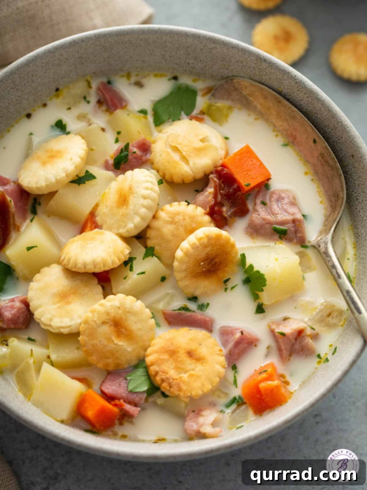 Hearty Ham and Potato Chowder 2 close up bowl of Ham and Potato Soup with oyster crackers