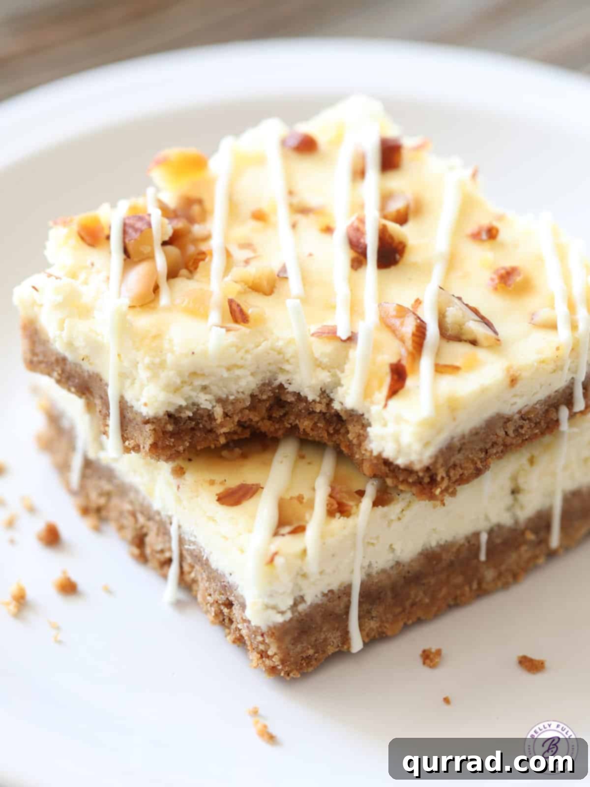 Spiced Eggnog Cheesecake Squares 4 2 stacked cheesecake bars with bite taken