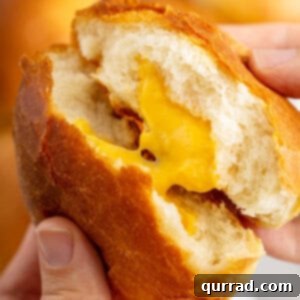close up image of cheese zombie being split in half, showcasing the melted Velveeta cheese