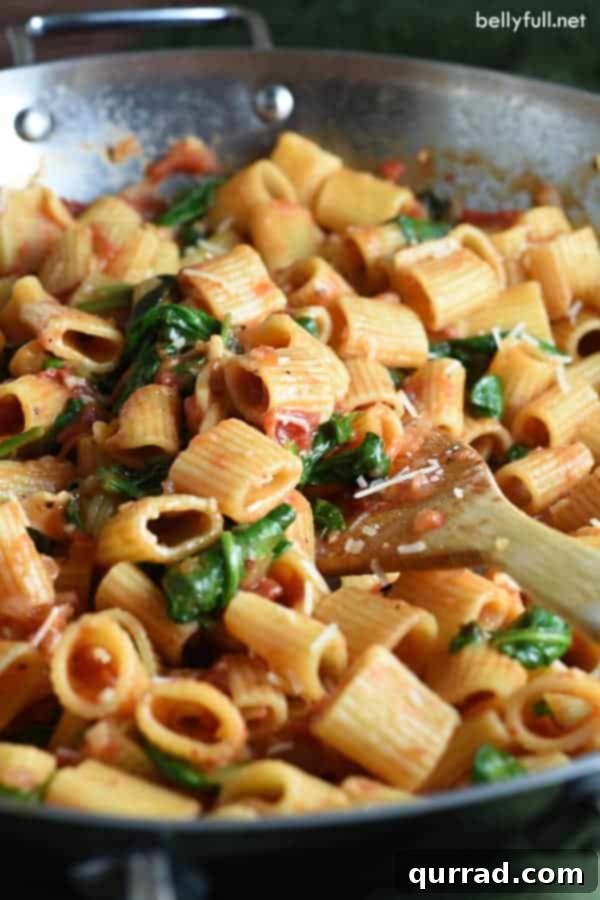 Close-up of One Pot Italian Pasta with fresh basil garnish in a serving bowl