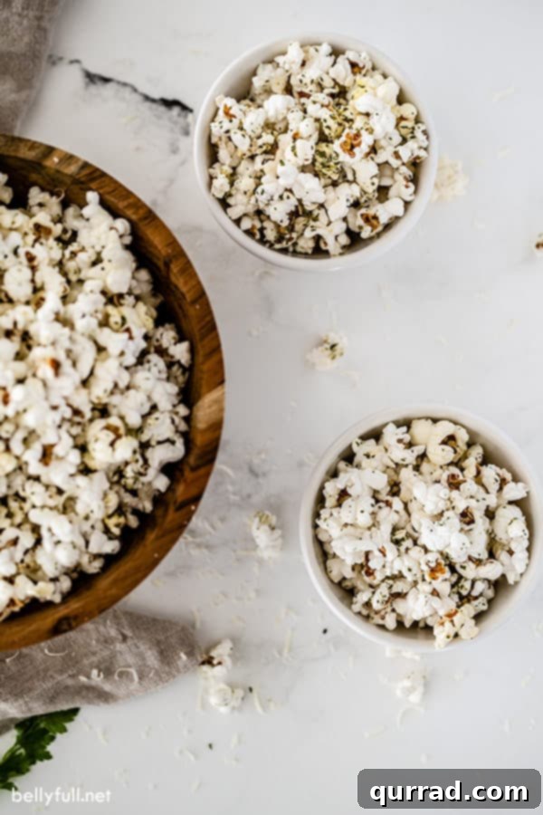 Garlic Bread Popcorn Ready to Serve in Various Dishes large serving bowl and 2 white dishes filled with flavored popcorn