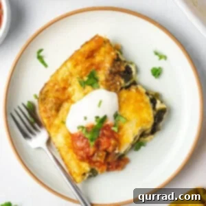 overhead square portion of chile relleno casserole on plate with fork