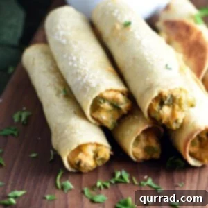 Crispy chicken and cheese baked taquitos ready to serve.