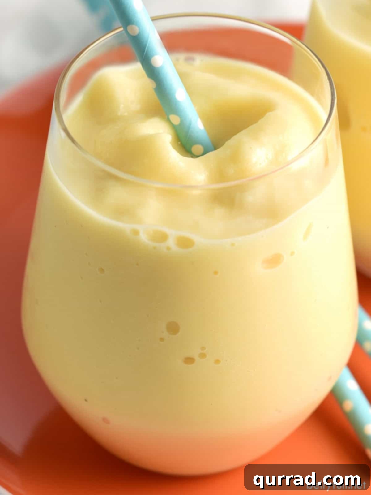 close up creamsicle slushy with straw