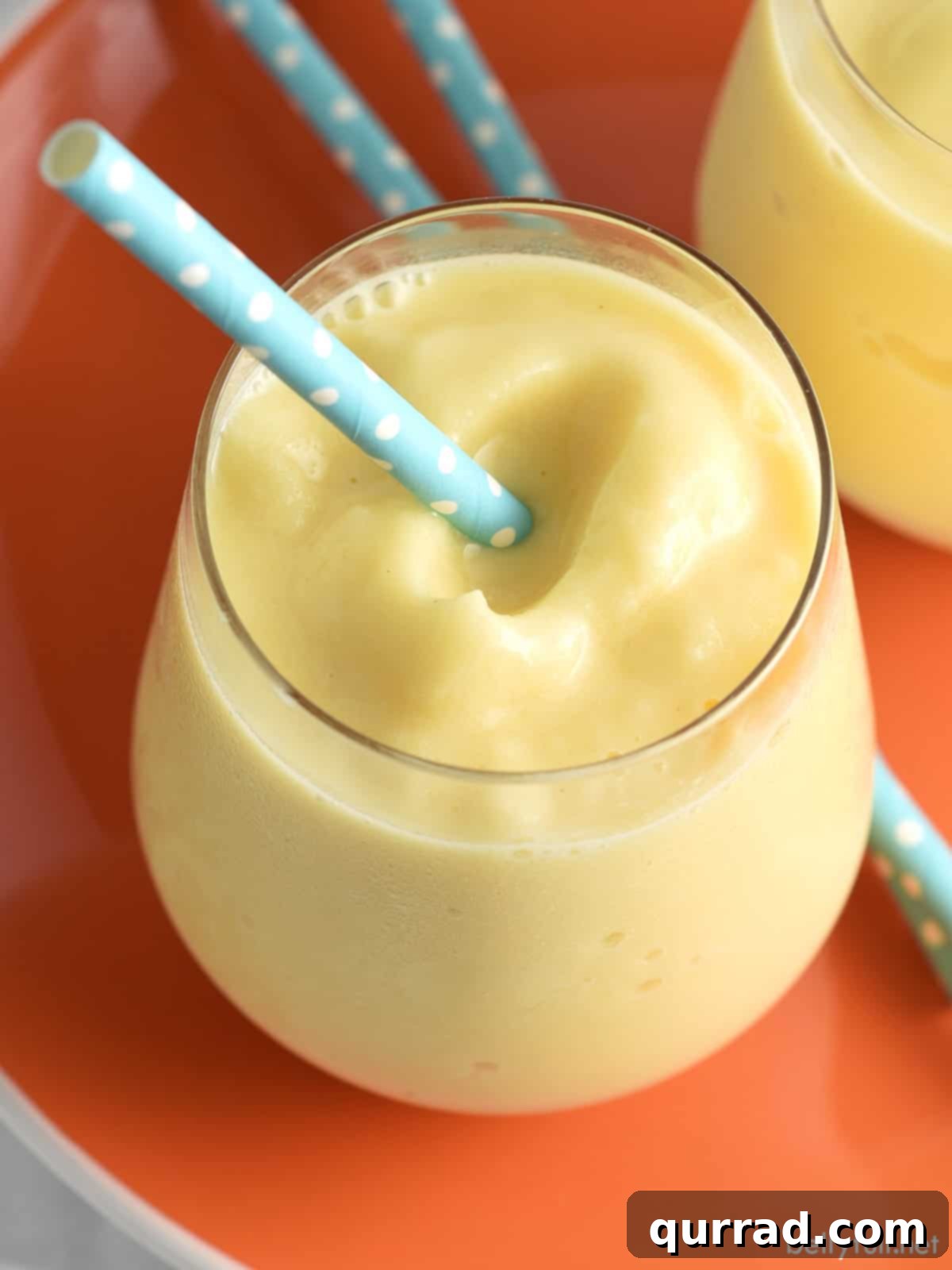 overhead orange slushy with blue straw