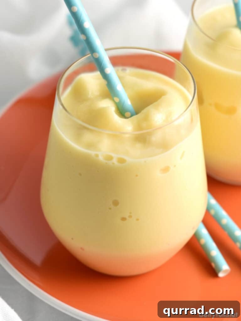 creamsicle slushy with blue polka dotted straw