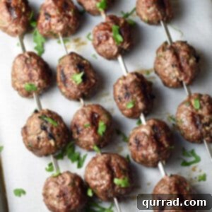 Spiced Beef Kofta Meatballs 5 overhead view of beef kofta kebob meatballs on metal skewers