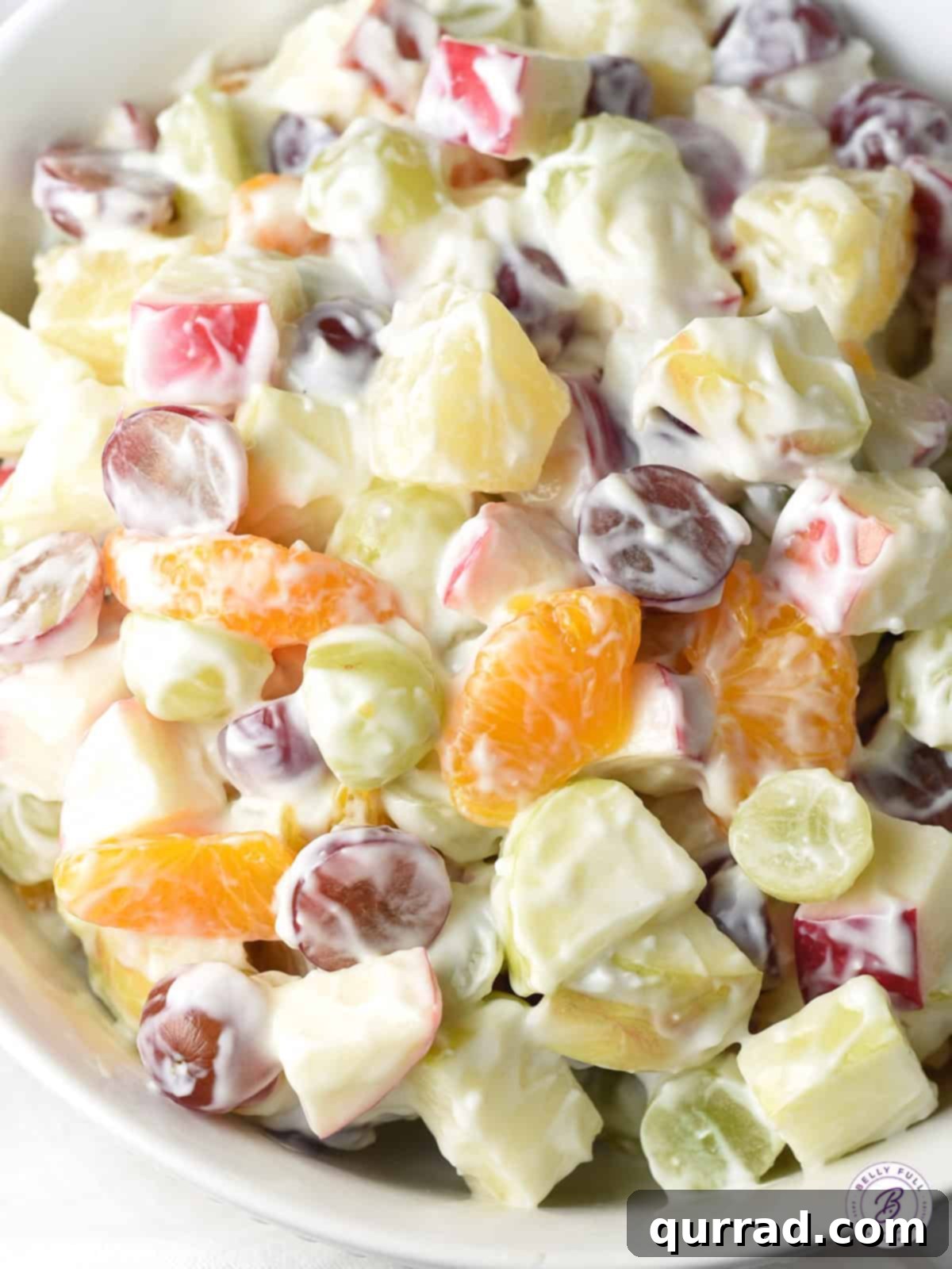 Velvety Gourmet Fruit Medley 2 overhead creamy fruit salad in bowl