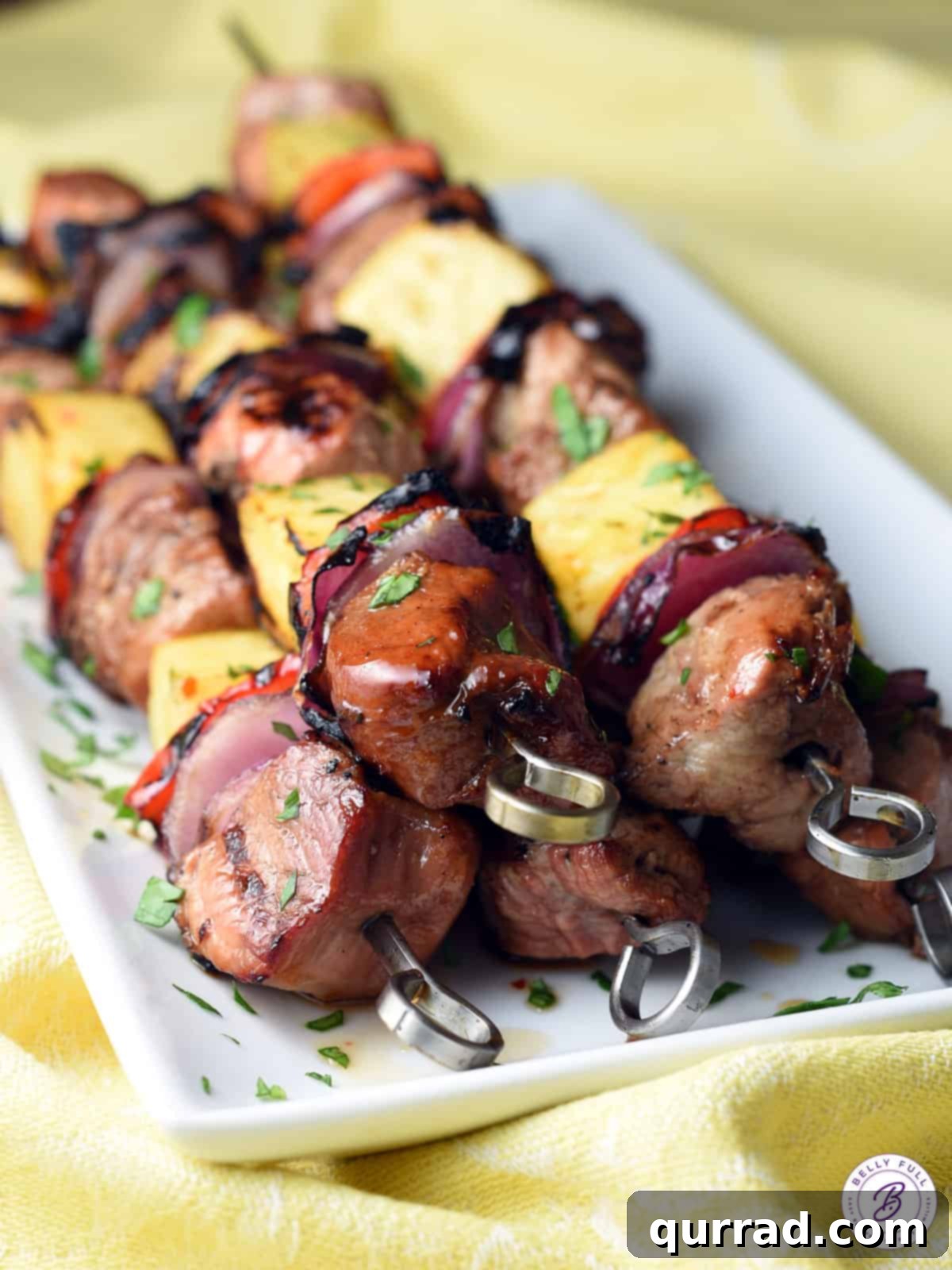 Flame-Kissed Teriyaki Pork Skewers 4 5 stacked grilled pork kabob skewers