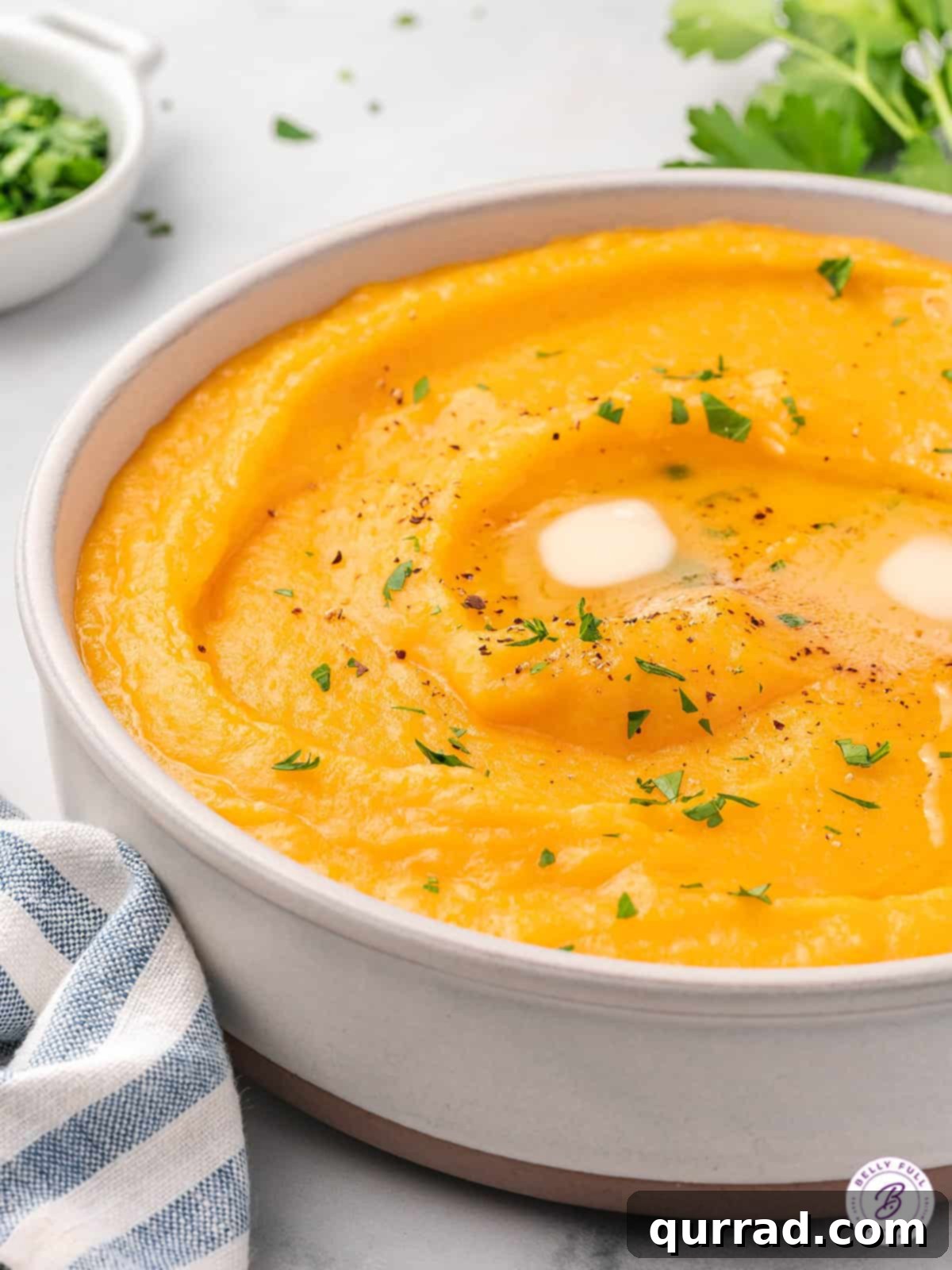 butternut squash mashed potatoes with melted pat of butter