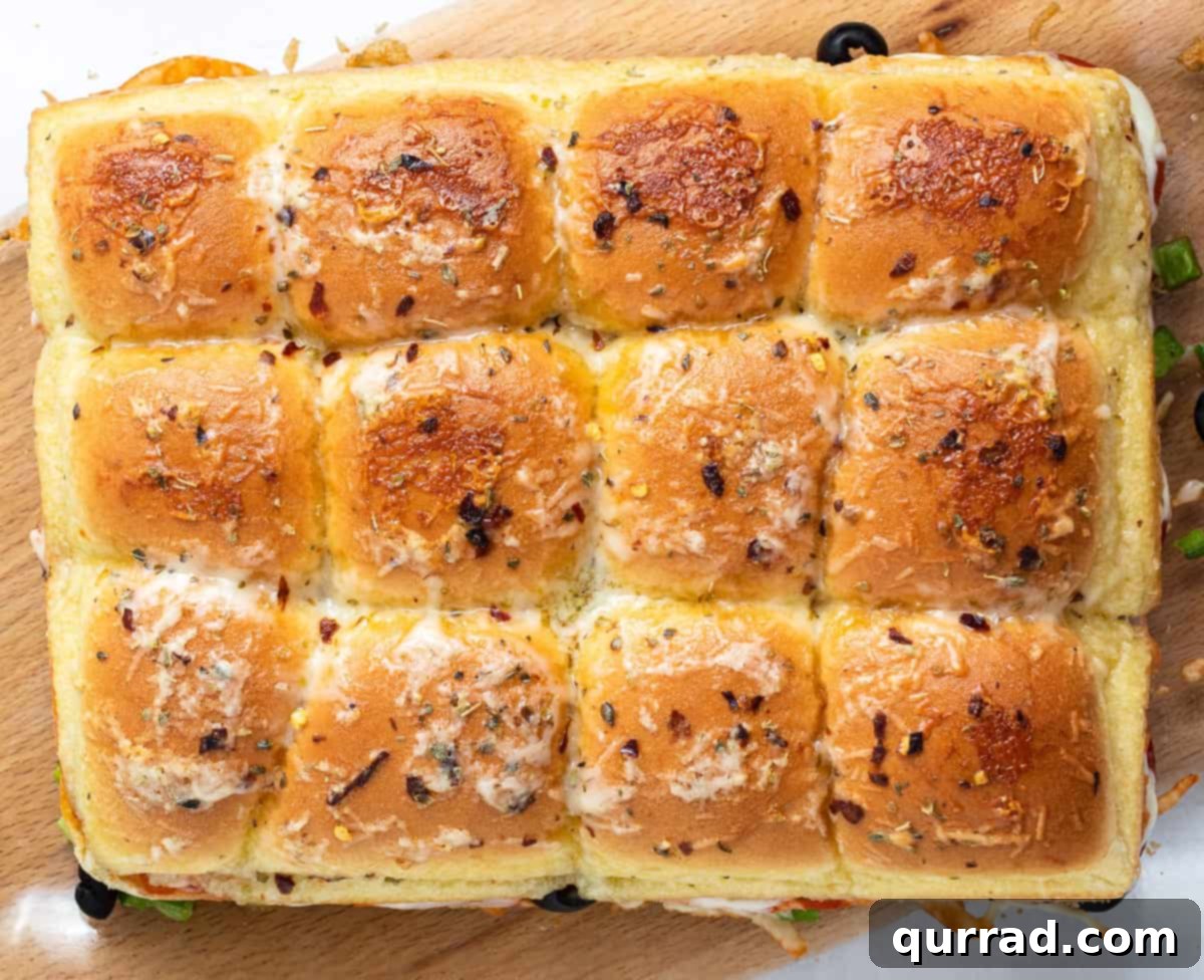 Supreme Pizza Pull-Aparts 3 Overhead view of 12 uncut baked Pizza Supreme Sliders, golden brown and ready to be sliced