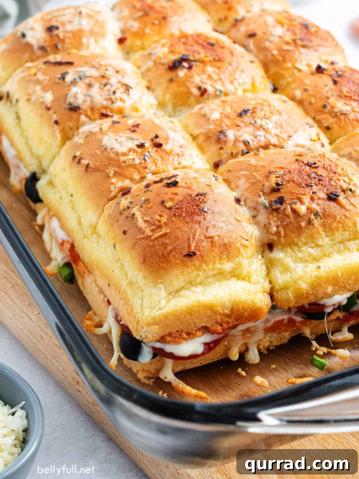 Supreme Pizza Pull-Aparts 4 Pizza Supreme Sliders baked to perfection in a glass baking dish, cheese melted and bubbly