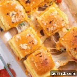 overhead pizza supreme sliders pulled apart with gooey cheese