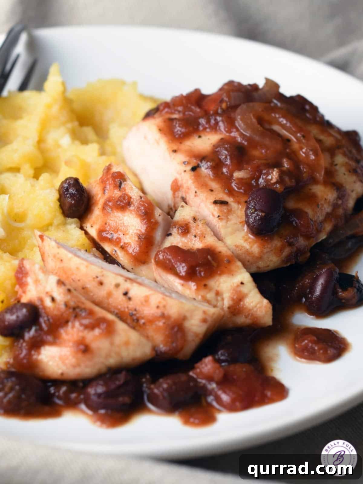 Tender Slow Cooker Balsamic Tomato Chicken 3 sliced chicken breast with black beans and tomato balsamic sauce in a crockpot