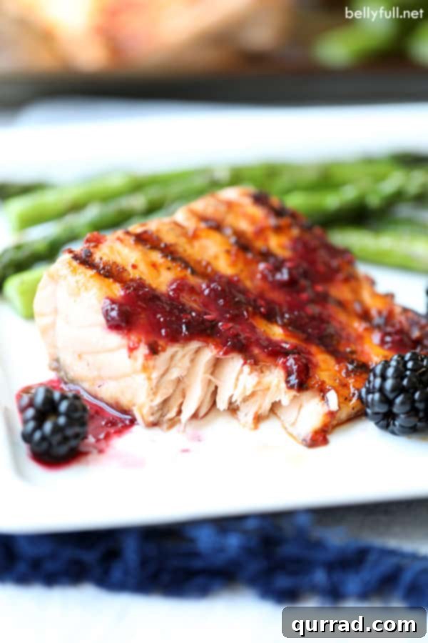 Flaked Grilled Salmon with Blackberry Sauce Flaked Grilled Salmon with Blackberry Sauce, showcasing its tender texture.