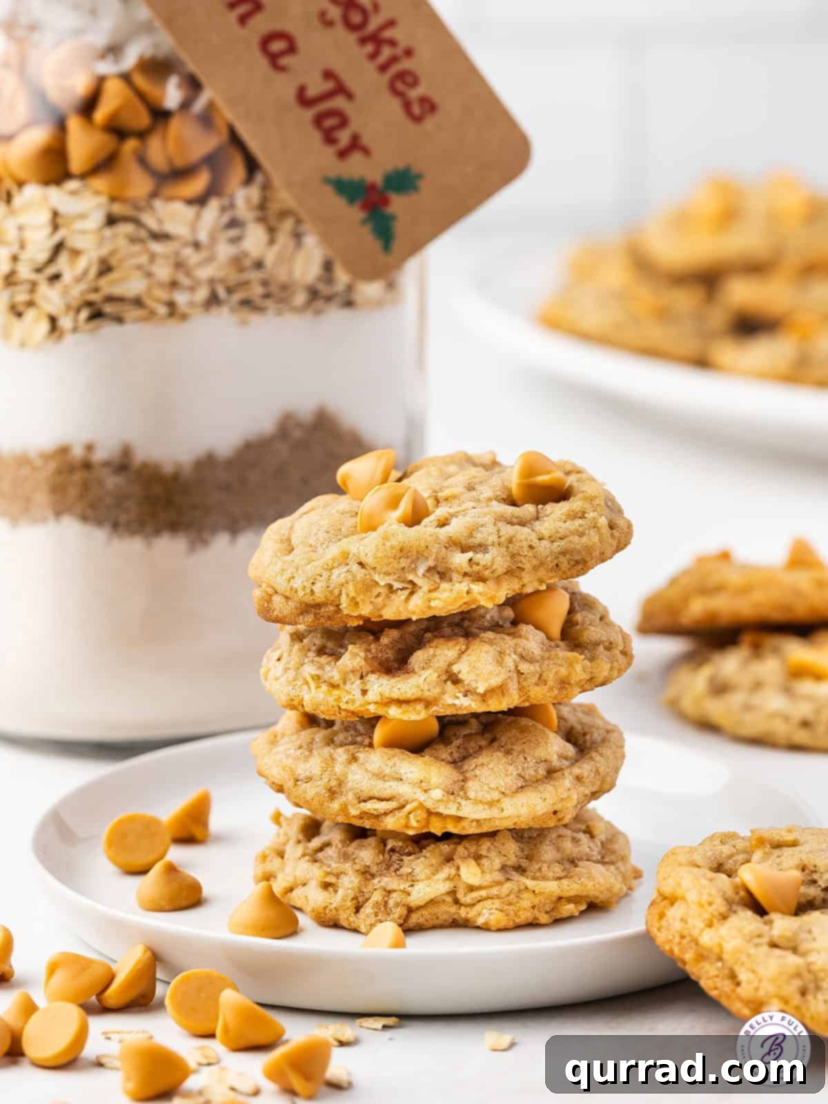 Layers of Cookie Joy 3 A stack of golden-brown butterscotch oatmeal cookies, showcasing their soft, chewy texture.