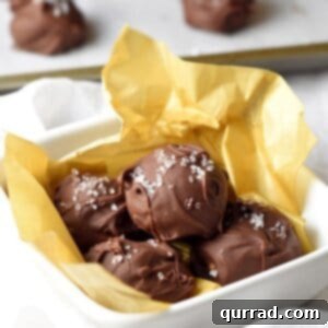 Rich and creamy homemade chocolate truffles made with almond butter and a hint of sea salt for a perfect balance of flavors!