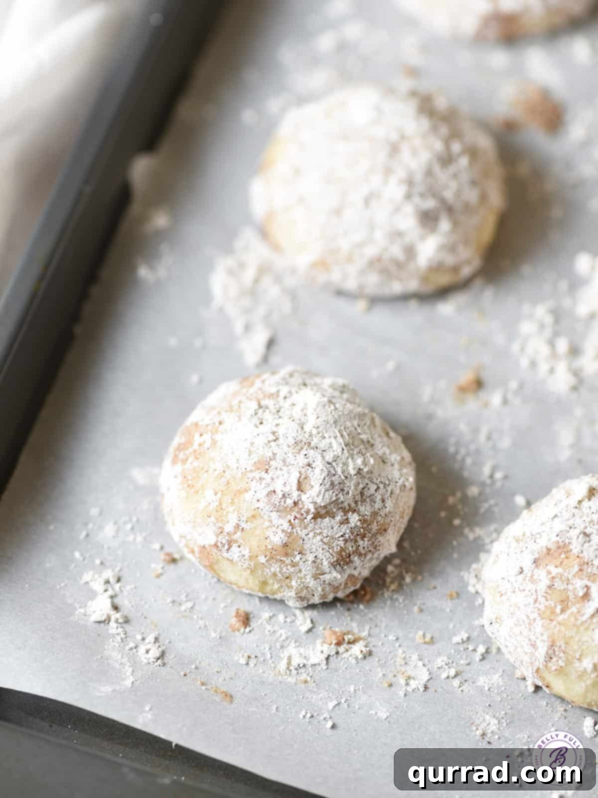 Cozy Chai Snowballs 4 overhead chair spiced snowball cookie on parchment paper