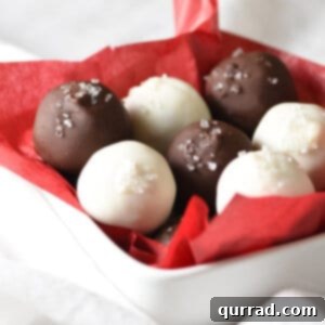 bowl of white and dark chocolate truffles in red tissue paper