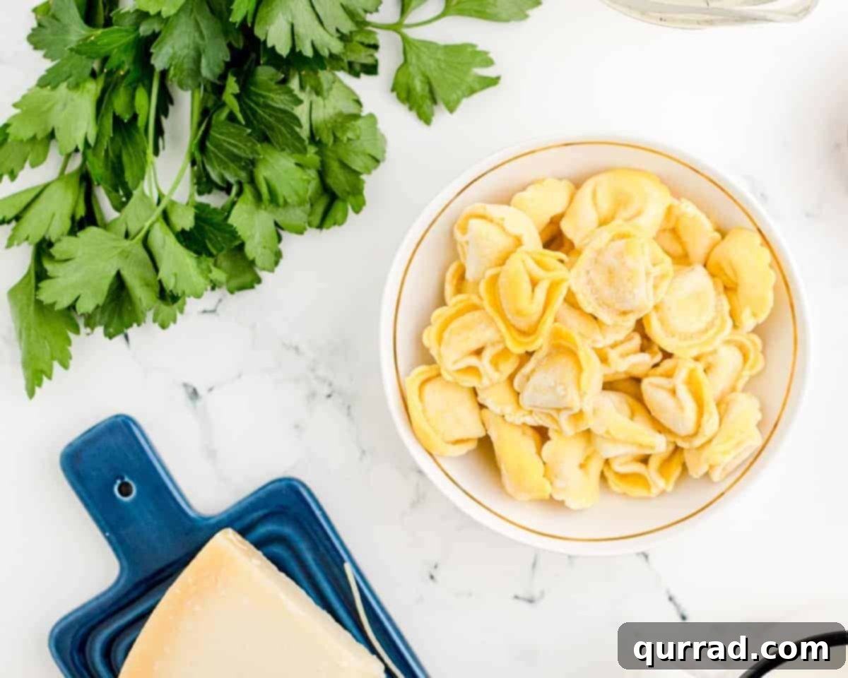 Ingredients to make tomato tortellini soup.