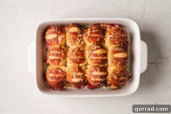 baked reuben pretzel sliders in casserole dish
