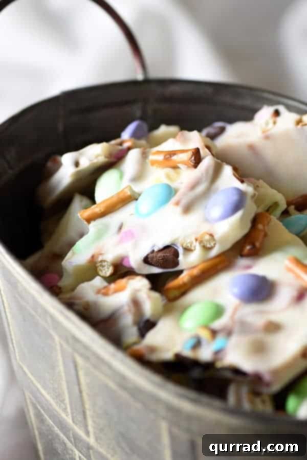 Effortless Easter and Spring Delights 3 Easter Pretzel Chocolate Bark with white chocolate, crunchy pretzels, and pastel M&Ms, a perfect easy treat for spring holidays.