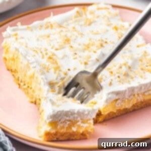 Pineapple Paradise Lush 6 square slice of pineapple lush with piece on fork