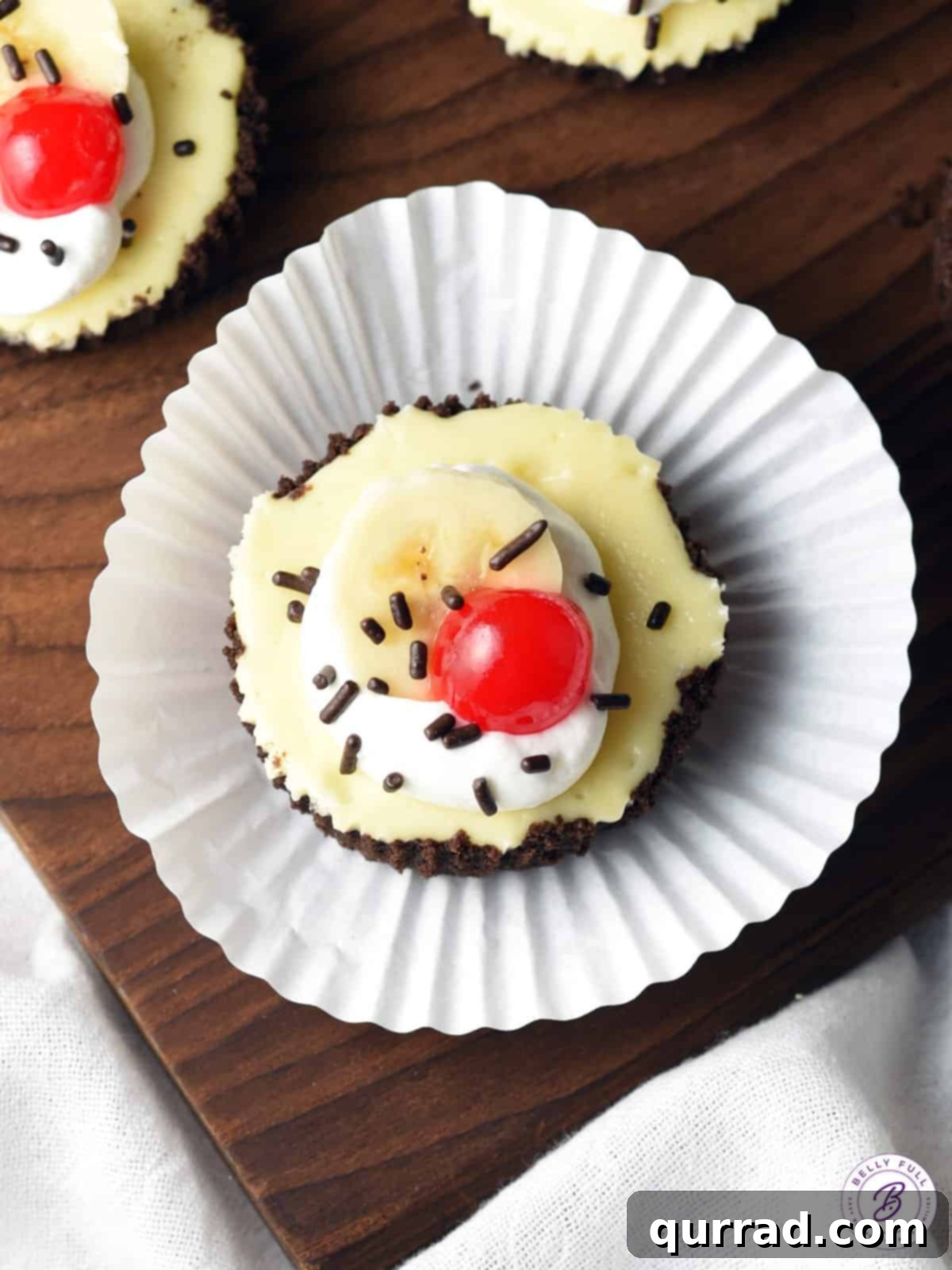 Banana Split Cheesecake Bites 3 oreo crusted mini cheesecake with banana split toppings