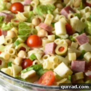 Italian Deli Chopped Salad 3 A close-up shot of the Italian Chopped Salad, highlighting the individual ingredients like pasta, cheese, and vegetables coated in a rich dressing.