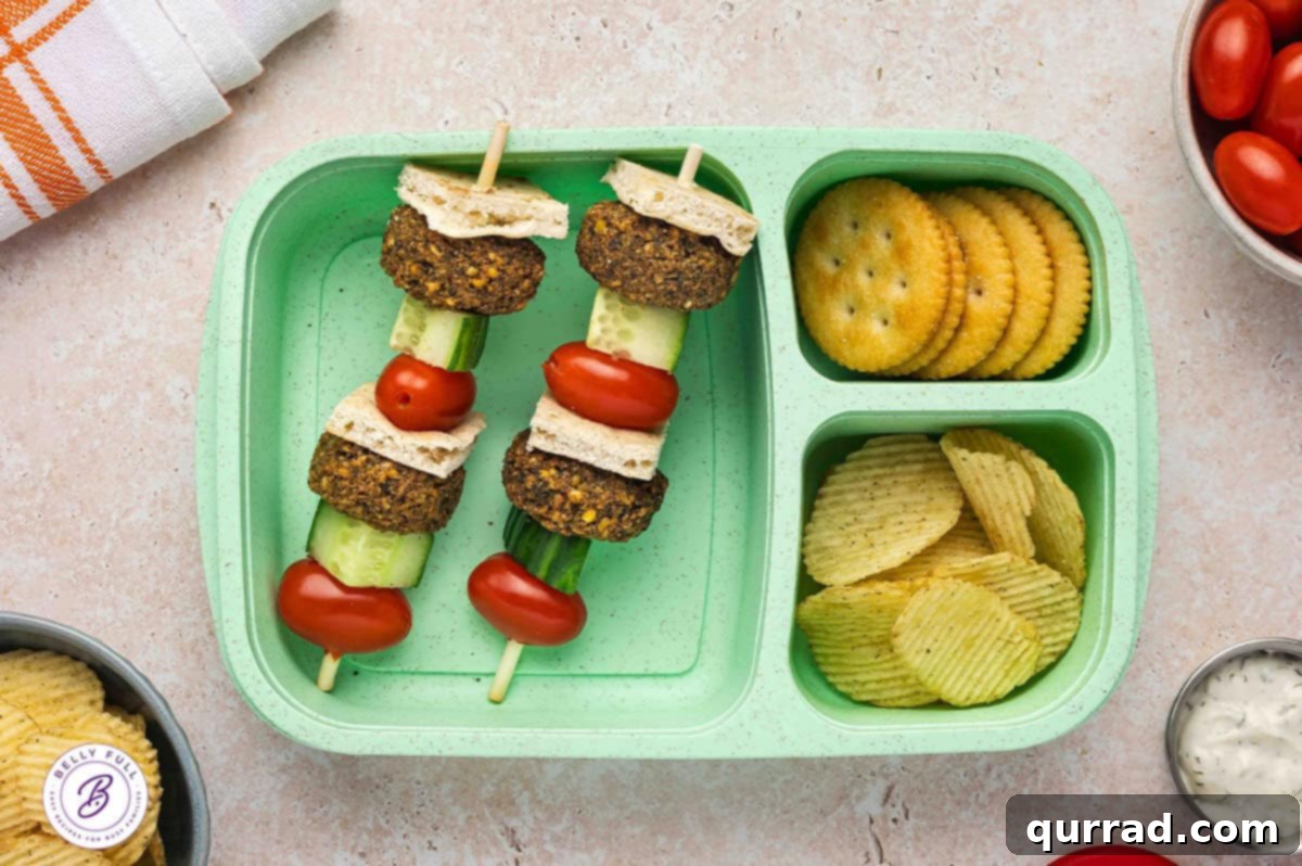 Skewered Sandwich Classics 10 Falafel on a stick with pieces of pita bread, falafel, cucumber, and cherry tomatoes, creating a vibrant vegetarian lunch.