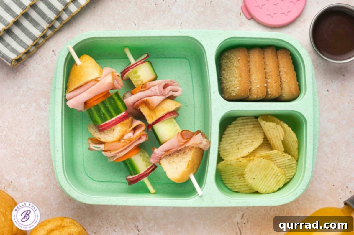 Skewered Sandwich Classics 12 Banh Mi sandwich on a stick made with pieces of French baguette, ham, carrot, cucumber, and radish, arranged in a vibrant lunchbox.