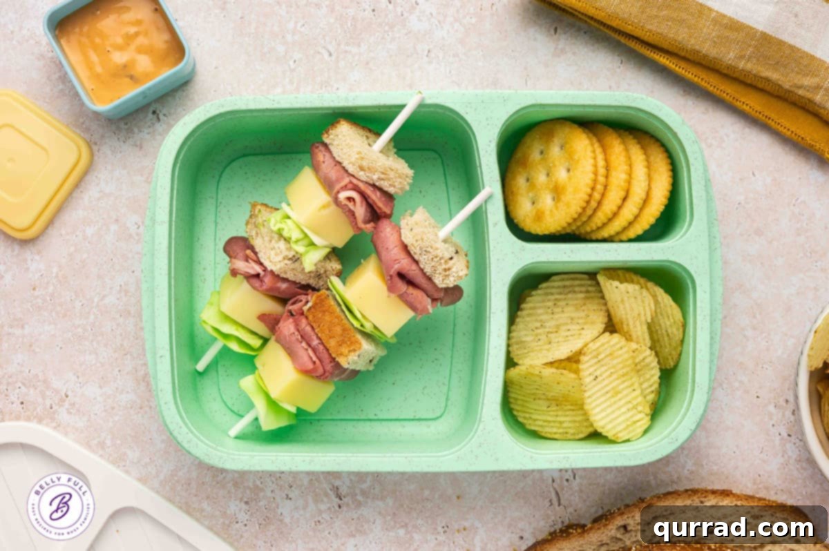 Skewered Sandwich Classics 5 Reuben sandwich on a stick with rye bread pieces, corned beef, Swiss cheese, and cabbage, packed for a unique lunch.