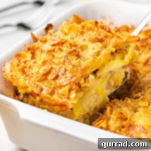 Yellow squash casserole portion on serving spatula