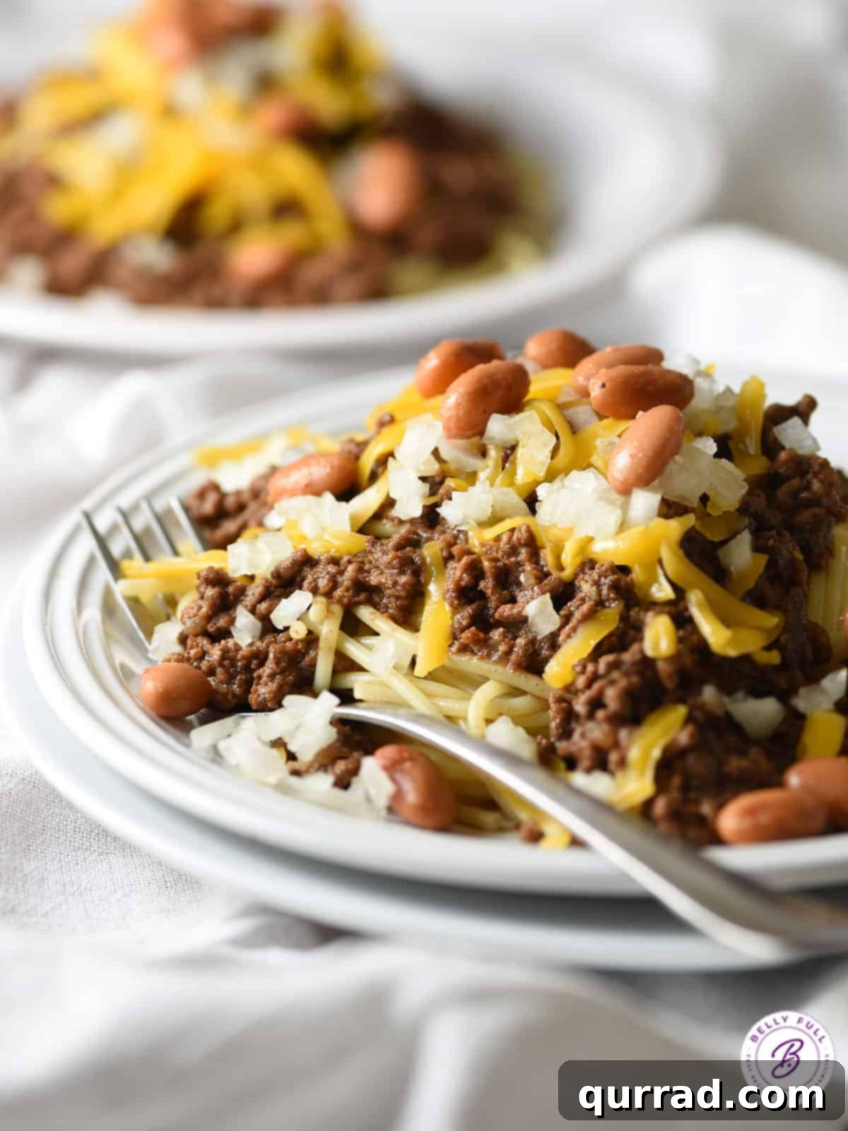 Cincinnati's Signature Chili 3 big mound of spaghetti topped with chili and cheese