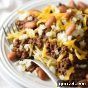 Cincinnati chili on white plate with fork