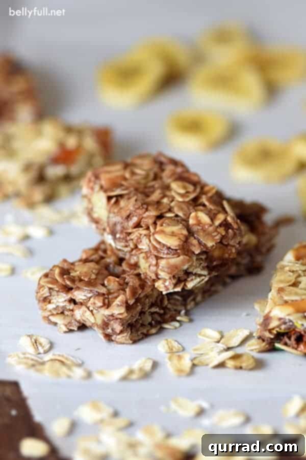 Quick & Creative No-Bake Granola Bar Ideas 2 Close-up of a stack of easy no-bake homemade granola bars, showcasing their soft, chewy texture and visible mix-ins like oats, nuts, and chocolate chips.