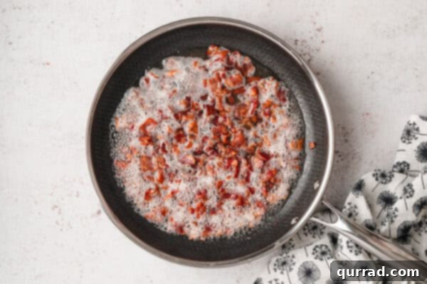 A pan filled with fried bacon pieces