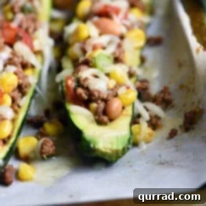 Taco Zucchini Boats are hollowed out zucchini, stuffed with all your favorite taco ingredients. Gluten free and healthy, these make a delicious appetizer, side dish, or main meal! #StuffedZucchini #ZucchiniBoats #tacos #glutenfree