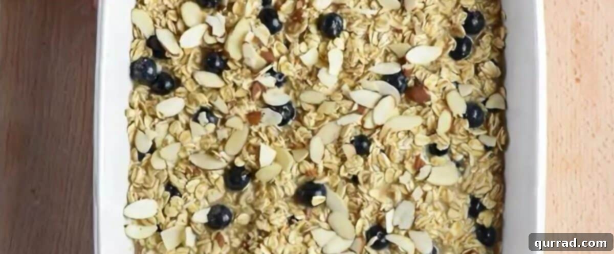 Cozy Blueberry Baked Oats 7 Baked oatmeal mixture in a white baking pan.
