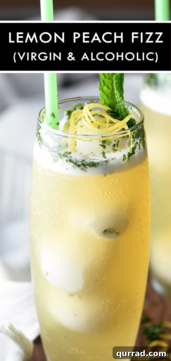 Sunshine Peach Fizz 3 Close-up shot of a vibrant Lemon Peach Fizz garnished with fresh mint and lemon zest, highlighting its refreshing appeal for summer parties.