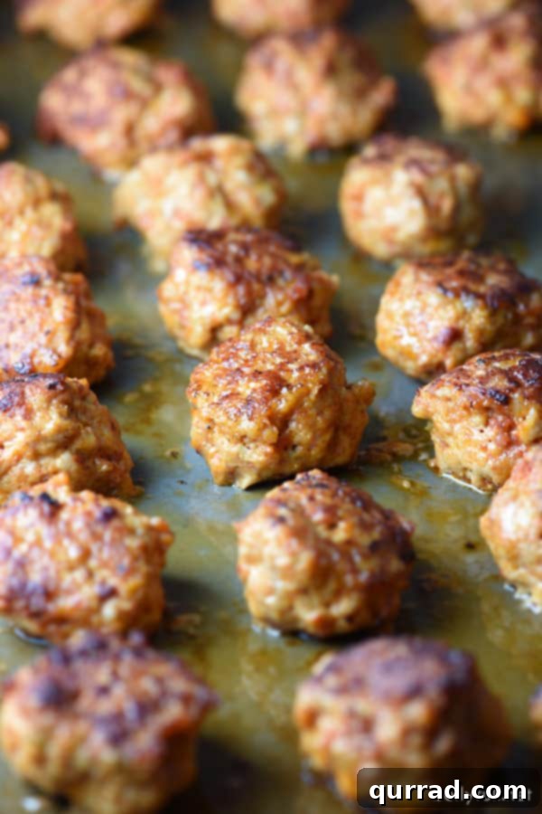 Close-up of golden brown Chicken Chorizo Meatballs in a skillet.